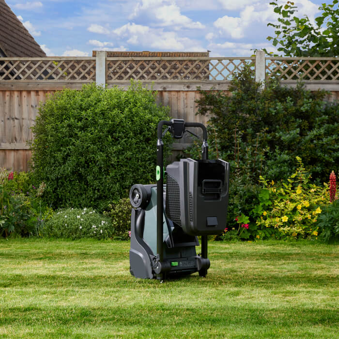 Hayter Hawk 36 folded for easy storage in a garden setting